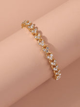 Load image into Gallery viewer, 'Rhinestone Heart Charm Bracelet' A high-polish bracelet composed of interlinked rhinestone heart charms and a lobster-clasp closure. Add a touch of elegance to your outfit with this glam fashion accessory! Metal Color: Gold Material: Alloy Color: Gold, shiny and cute Type: Link Details: Heart, Rhinestone Style: Casual Length: 17.5 cm
