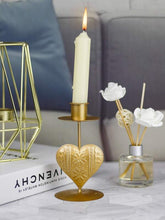 Load image into Gallery viewer, '1pc Heart Design Candle Holder' - this elegant article provide a secure and safe base for candles to avoid any mishaps. This gold coloured candle holder will make the environment stylish and will add a romanticism touch to any environment!      Colour: Gold     Type: Candle Holder     Material: Iron     Size: Length(7.2cm/2.8inch) Width (7.2cm/2.8inch) Height (12.7cm/1.1inch)     Candle included     Gift box included     Object to be used with caution.
