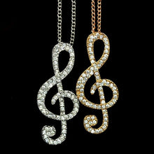 Load image into Gallery viewer, Silver colour Women Lady Crystal Silver Gold Musical Note Pendant Necklace Sweater Chain. Adorable treble clef pendant with light chain. Gift idea for musicians and music lovers. 100% Brand New Material: Alloy + Crystal Color: Silver (last available) Pendant size: About 5.5 x 2cm Necklace length: Approx 62cm Quantity: 1Pcs Package includes: 1 x Music Note Necklace, mini jewel bag and charm cloth