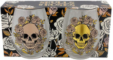 Load image into Gallery viewer, stylish and spooky glasses - each with a capacity of 500 ml approx - is an ideal size for any kind of drinks (wine, juice, cocktails or a large gin & tonic with botanicals). Featuring a skulls and roses decoration (mexican style), one glass is decorated in a matt peach colour and the other with a shiny gold colour. The item comes inside a gift box to make a great gift. Home decor item / romantic gothic table decor / Halloween / day of the dead gift idea