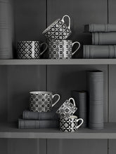 Load image into Gallery viewer, “Encaustic Tile” 4-Piece Set of Fine China Mini Mugs (Coffee espresso cups) by Creative Tops. Enjoy a hot drink with family and friends with this pretty Black and White set of 4 espresso cups, made from fine china in a combination of 2 designs, combining Fleur de Lys and petal pattern. A vintage unique product.  Presented in a stylish old gift box, making it the perfect gift for anyone who loves coffee.