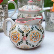 Load image into Gallery viewer, This beautiful Barcelona design Moorish small milk jug with hand-painted flowers on cream stoneware would make a brilliant present for a foodie friend. Elegant gift idea (Table decoration collection). Both dishwasher and microwave safe. Jug capacity:  1/2 Pint 0.28 L. Material: Stoneware (kitchenware item) Dimensions: Length: 11 cm X Height: 8 cm X Width: 5.5 cm
