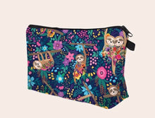 Load image into Gallery viewer, Comfy handy portable bag colored with a sweet sloth, flowers and night spring joyful patterns. Useful for accessories, jewellery, make-up and miscellaneous items. Don't give up this adorable item for home, school, travel and more! Gift idea Sloth Pattern Makeup Bag Color: Multicolour Power Supply: No Material: Polyester Composition: 100% Polyester Size Length 22 cm X Width 13.5 cm X Height 5 cm