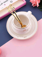 Load image into Gallery viewer,  '4 pcs of this adorable music spoon set with floral design! Match it with other Rovistella's item such as the espresso cups and make your guests surprised by the beauty of this set!'      Colour: Gold     Pattern Type: Floral/Music     Type: Spoon     Material: Stainless Steel (dry it well after washing by hand)     Size: Length 13.5 cm (5.3 inch) X Width 2.8cm (1.1inch)