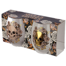 Load image into Gallery viewer, stylish and spooky glasses - each with a capacity of 500 ml approx - is an ideal size for any kind of drinks (wine, juice, cocktails or a large gin & tonic with botanicals). Featuring a skulls and roses decoration (mexican style), one glass is decorated in a matt peach colour and the other with a shiny gold colour. The item comes inside a gift box to make a great gift. Home decor item / romantic gothic table decor / Halloween / day of the dead gift idea