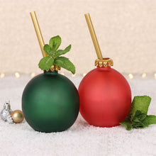 Load image into Gallery viewer, 'Set of 2 Bauble Glasses' - This set of festive glass like bubbles is sure to make Christmas even more merry! The set contains one red and one green frosted glass baubles with a reusable gold coloured plastic straw. The baubles come packaged in a gift box tied with twine. Drinkware Christmas balls, home decor, gift idea Gift Box Dimensions: H:9cm W:18cm D:11cm