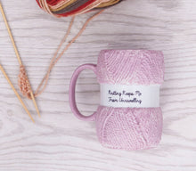 Load image into Gallery viewer,  A funny knitting themed mug, great for a knitting fanatic. Unwind with a cup of tea with this hilarious ceramic knitting mug, complete with a decorative gift box. Shaped like a pink ball of wool with the text "Knitting keeps me from unravelling", this mug is a knitting lovers dream come true. A perfect gift for that knit lover on the birthday, at Christmas or an all year round gift.      Colour: Pink     Material: Ceramic     Dimensions Depth : 9.70 cm X Height : 12.50 cm X Width : 8.20 cm