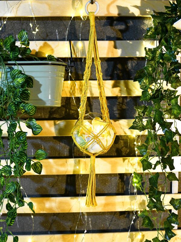 '1pc Macrame Plant Hanger' - This hanger can contain flowers or plants pot, making any environment trendy and ecological! Create your indoors garden with it! Reminder: make sure you do not weigh the container too heavy and hang it properly!'      Colour: Yellow     Type: Wall Hanging     Material: Polyester     Size. Height (63cm/24.8 inch)     Bowl container and candles included     Flowers, stones and hanging accessories not included