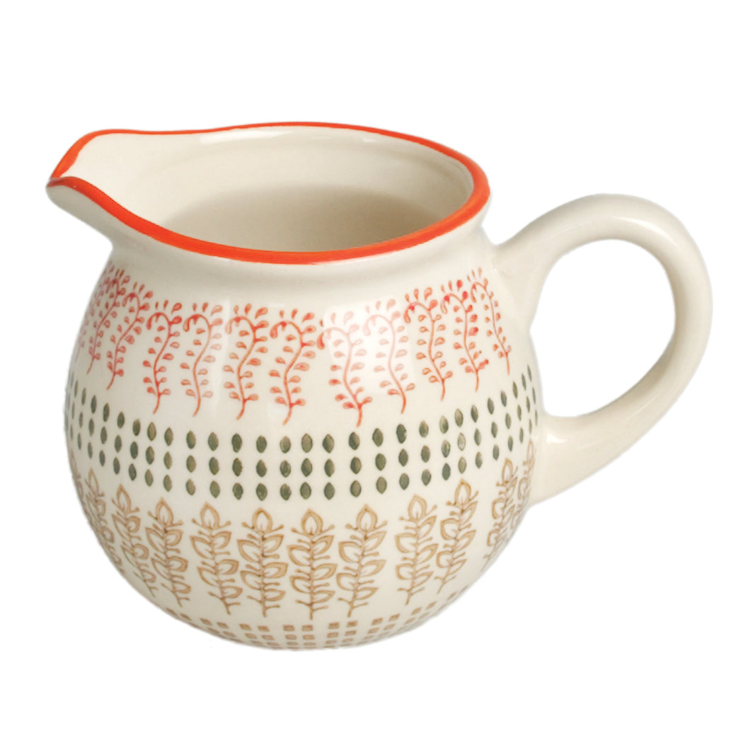 'Handy Moorish Milk Jug - Marrakesh table decor style' This beautiful Moorish small milk jug, from Morocco, with hand-painted leaves on cream stoneware would make a brilliant present for a foodie friend. Lovely home decor item and gift idea! The item comes in a gift box.      Both dishwasher and microwave safe.  Jug capacity:  1/2 Pint 0.28 L.     Material: Stoneware     Dimensions: Length 12 cm, Height 8 cm, Width 6.5 cm