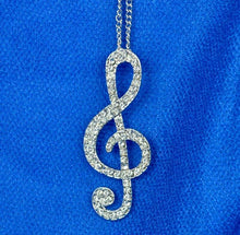 Load image into Gallery viewer, Silver colour Women Lady Crystal Silver Gold Musical Note Pendant Necklace Sweater Chain. Adorable treble clef pendant with light chain. Gift idea for musicians and music lovers. 100% Brand New Material: Alloy + Crystal Color: Silver (last available) Pendant size: About 5.5 x 2cm Necklace length: Approx 62cm Quantity: 1Pcs Package includes: 1 x Music Note Necklace, mini jewel bag and charm cloth

