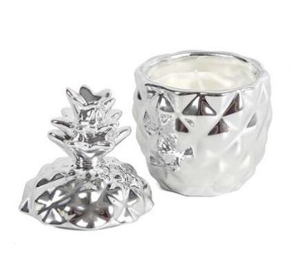 '2 Small Pineapple Candles' Quirky little silver pineapple with removable lid to reveal a small candle. Funky modern home decorative piece. Home decor item and cute gift idea for candle lovers. The items come in a gift box.