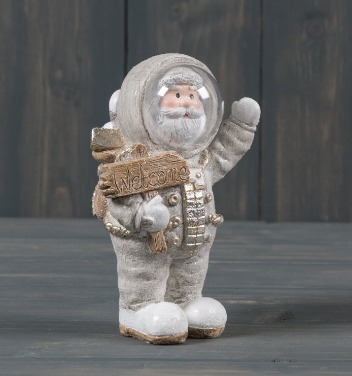 Standing Space Santa Claus Father Christmas, 12.5cm  A standing Santa decoration dressed up as an Astronaut, sure to add a charming twist to any White Christmas Winter Festive Display  Home decor item and gift idea Size is 12.5cm x 8cm in size