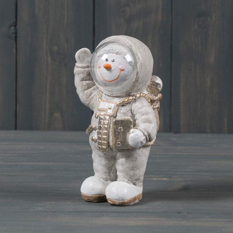 A cute and quirky polyresin Snowman dressed up as an Astronaut. A perfect little decoration to add to any Space themed display at Wintertime or Christmas!  Size is 13cm x 9cm in size, Item fragile, Xmas decor and gift idea.