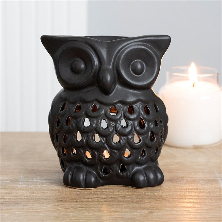 'Black Owl Oil Burner Charming black owl oil burner which looks beautiful when a lit tealight is placed inside. This burner has a deep bowl making it perfect for using with oils to fragrance the home. This item can also be used as a wax melt burner however it is advisable to consider the size and depth of the bowl when adding wax to ensure it will not overrun the edges when melted. Halloween Home decor and Noir style gift idea.  Material: Ceramic