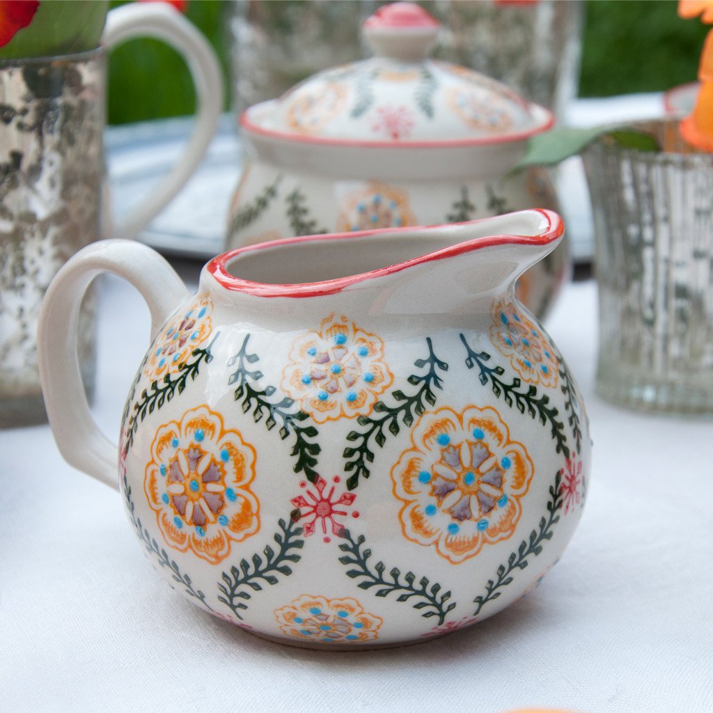 This beautiful Barcelona design Moorish small milk jug with hand-painted flowers on cream stoneware would make a brilliant present for a foodie friend. Elegant gift idea (Table decoration collection). Both dishwasher and microwave safe. Jug capacity:  1/2 Pint 0.28 L. Material: Stoneware (kitchenware item) Dimensions: Length: 11 cm X Height: 8 cm X Width: 5.5 cm