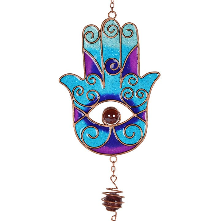  'Blue Hand of Hamsa Windchime' - Stunning windchime, elegant gift idea would make a great addition to an outdoor zen den or meditation garden. In many cultures the Hand of Hamsa represents the Hand of God and is seen as a protective symbol. Hang it in the garden area, will give a touch of mystic style to your home. Lovely home decor item.      Material: Metal     Dimensions: H67cm X W9cm X D4cm     The items comes in a gift envelop.