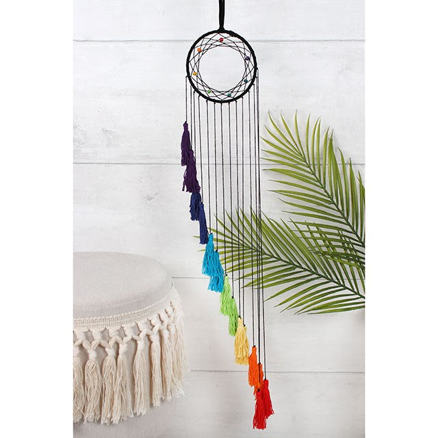 Beautiful small circular multicolour dreamcatcher with long hanging tassels. Created in the rainbow colours of the chakra. Tassels are tiered in length. This chakra dreamcatcher is a great gift idea for those who use reiki or practice yoga to help enhance their spiritual and physical wellness. Size: Heiht:80cm Width:12cm Diameter:12cm Weight: 35g Home decor item and gift idea