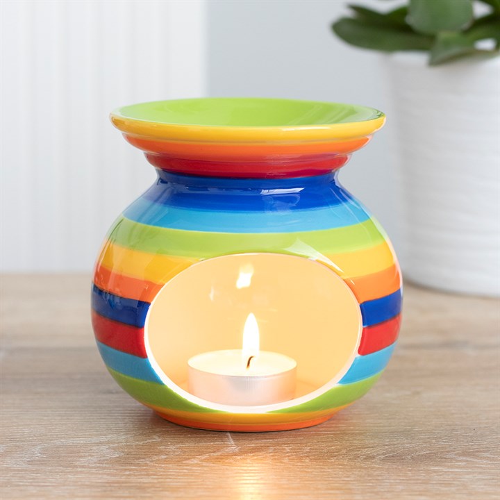 COLOURFUL RAINBOW STRIPE OIL BURNER - This ceramic oil burner with vibrant rainbow stripes can be used with both fragrance oils and wax melts to fragrance the home. Home decor item and cool gift idea. Colour: Multicolour Material: Ceramic Dimensions: H10.5cm X W10cm X D10cm Weight 342g