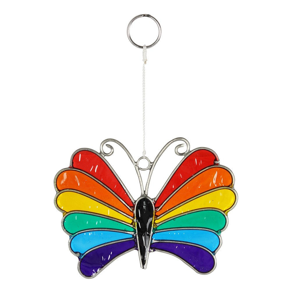 Colourful rainbow butterfly suncatcher which is sure to brighten someone's day. Hang in windows, conservatories or gardens for an uplifting splash of colour - under the sunny rays, it will reflect the lights creating a fantastic atmosphere. Lovely gift idea for butterflies lovers. Use it as a home decoration during the gay pride celebration too. The item comes in a gift box. Material: resin Dimensions: Height 13cm X Width 9cm X Diameter 0.1cm Weight 30 gr approx.