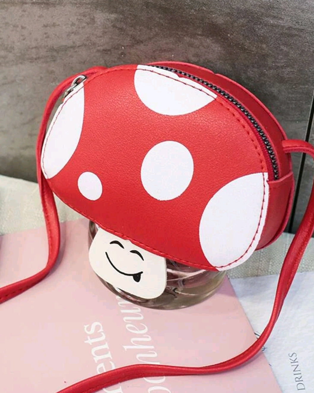 This adorable Mushroom Design Cross-body Bag, red in white spots, is a lovely accessory to use when you go out with friends! Easy to carry, fashionable, easy to wash by hand. How pretty she is!      Pattern Type: Cartoon, Polka Dot     Magnetic: No     Bag Size: Mini     Composition: 100% PU Leather     Material: PU Leather     Size: Length 13cm X Width 4cm X Height 9cm X Strap Length 80cm