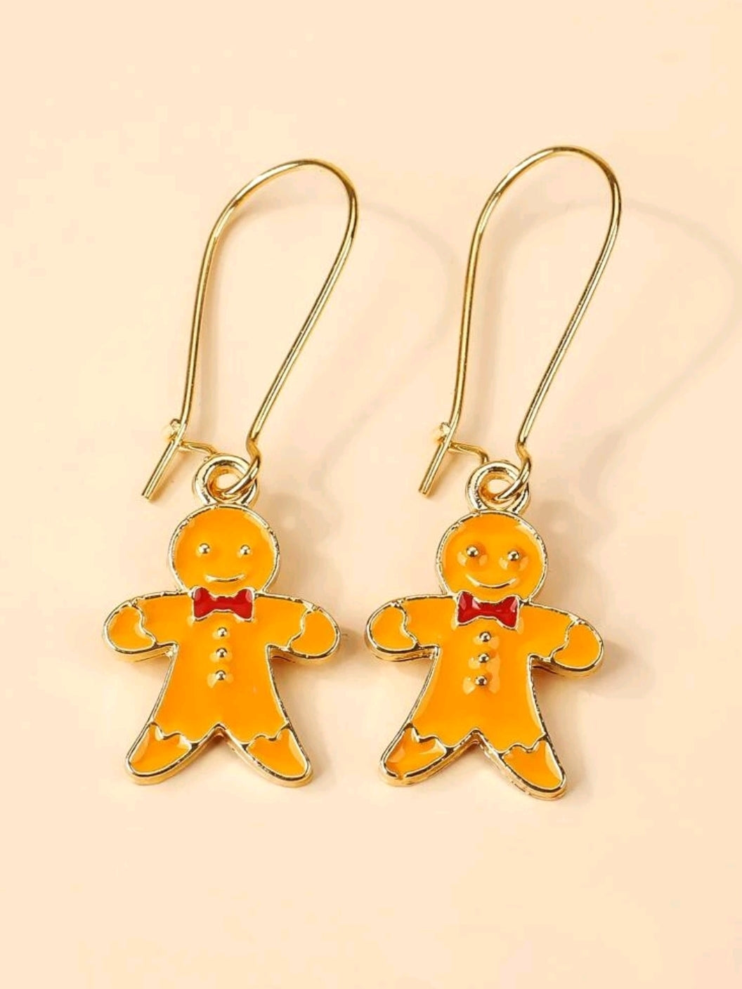  Funny couple of Christmas Gingerbread Man Drop earrings. Unisex accessory. Lovely gift idea. Festive outfit!      Metal Color: Gold     Material: Alloy     Color: Orange     Type: Dangle     Style: Glamorous Casual     Size: Eardrop Height 3.5 cm (1.4 inch ) X Eardrop Width 1.5 cm (0.6 inch)