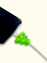 Load image into Gallery viewer, This Christmas, do not give up being highly tech! Get this cute data cable protector (Christmas Tree design) for mobile phone charger. During the holidays, show this accessory for technological devices to your friends, they will love it!  Color: Green Pattern Type: Christmas Type: Cables Protectors Material: Silica gel Size: Length 3cm (1.2 inch) X Width 3cm (1.2 inch) X Height 1.2cm (0.5 inch)
