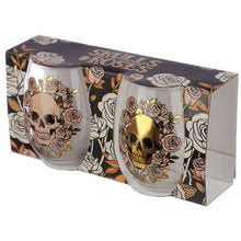 Load image into Gallery viewer, stylish and spooky glasses - each with a capacity of 500 ml approx - is an ideal size for any kind of drinks (wine, juice, cocktails or a large gin &amp; tonic with botanicals). Featuring a skulls and roses decoration (mexican style), one glass is decorated in a matt peach colour and the other with a shiny gold colour. The item comes inside a gift box to make a great gift. Home decor item / romantic gothic table decor / Halloween / day of the dead gift idea
