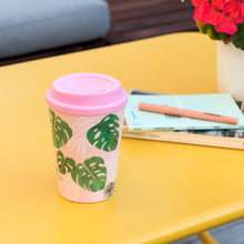 Load image into Gallery viewer, Trendy Tropical Palm Reusable Plastic Travel cup: Pinky and Tropical leaves Design, take it with you in the morning to drink your favourite beverage or keep it in your bag on a trip so you can have your own cool mug!
