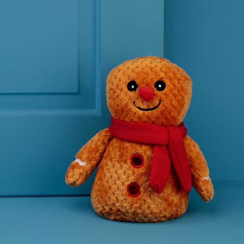 Christmas Plush Gingerbread Man Door Stop with red scarf. Funny gift idea for home decor lovers. Cosy decoration for festive time.   Material: Outer 100% Polyester, Inner 50/50 Sand and Polyester Wadding Product Information: For indoor decorative use only. This is not a toy, keep out of reach of children. Dimensions: Height 24cm Width 18cm Depth 12cm Weight 1.407 Kg