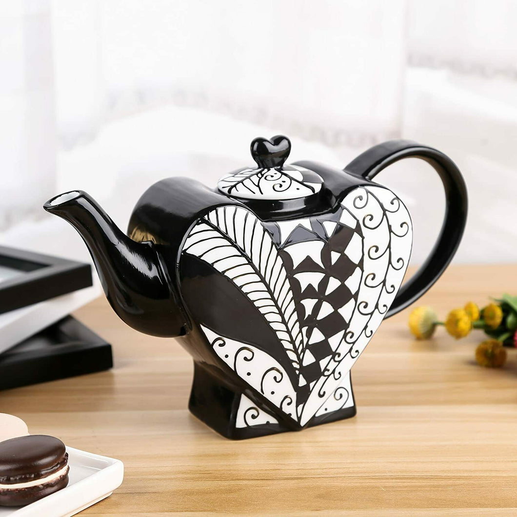 What a beautiful Heart Shape Teapot! When you want to enjoy a Coffee with your friends, show this stylish Black and White teapot. Perfect for a Tea party. Some lovers use it as a Saint Valentine's present! Unique gift for tea lovers and Alice in Wonderland's Queen of Hearts fans. For wedding favours, write to info@rovistella.com      Material: ceramic     Features: Dishwasher Safe     Condition: new, antique style