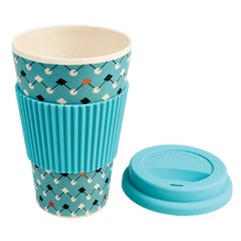 Load image into Gallery viewer, This eco-friendly travel mug comes in a bold Atomic Blue design, and is made from bamboo fibre. Complete with a silicone lid and sleeve to prevent spillages and protect hands.
