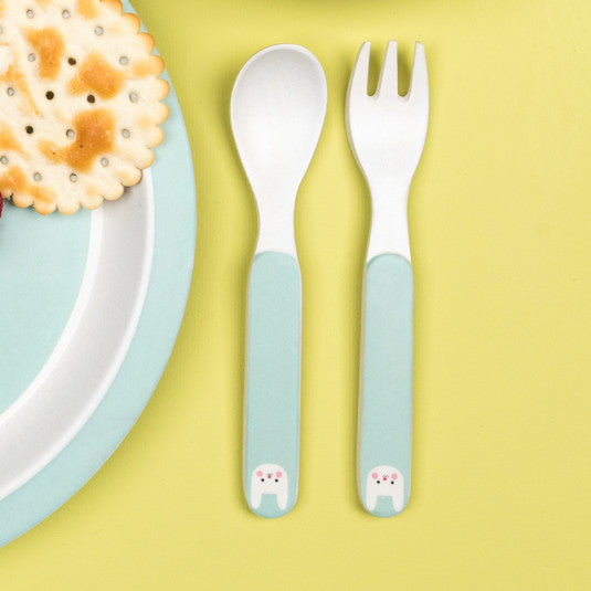  'Bibi The Bunny Bamboo Cutlery Set - Part of the wonderful range of original tableware, this bamboo fibre spoon and fork set is perfect for little hands. take it with you when the little ones have to eat and they will learn to respect the environment by using these cutlery in natural materials'      Spoon: 14cm (length) 2.5cm (width)     Fork: 14cm (length) 2cm (width)     Matching bowl, beaker and plate available     Dishwasher safe     Not for microwave