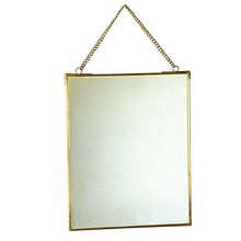 Load image into Gallery viewer,  Part of the Jaipur glassware range, this gorgeous brass hanging mirror is a wonderful home decoration. It will add a touch of elegance to any environment.      Mirror measures 20x25cm     Mirror length including chain: 34.5cm     Material: Glass, Brass     Dimensions: Length: 0.5 cm Height: 25 cm Width: 20 cm 
