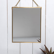 Load image into Gallery viewer,  Part of the Jaipur glassware range, this gorgeous brass hanging mirror is a wonderful home decoration. It will add a touch of elegance to any environment.      Mirror measures 20x25cm     Mirror length including chain: 34.5cm     Material: Glass, Brass     Dimensions: Length: 0.5 cm Height: 25 cm Width: 20 cm 
