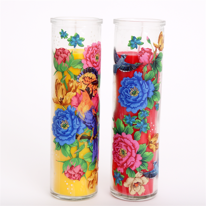 '20 cm Floral Set of 2 Candle Pot' - Mexican-inspired florals adorn the outside of these tall colourful festive glass pillar candles. Reminiscent of traditional Mexican prayer candles, these vibrant styles will brighten up any altar space or centrepiece. When purchased in multiples of 2, you will receive one red and one yellow variation. Approximate burn time of 25 hours. Material: Glass, Wax Dimensions: H 20cm x W 5.5cm x D 5.5cm Gift box included