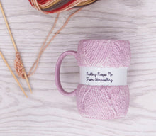 Load image into Gallery viewer,  A funny knitting themed mug, great for a knitting fanatic. Unwind with a cup of tea with this hilarious ceramic knitting mug, complete with a decorative gift box. Shaped like a pink ball of wool with the text &quot;Knitting keeps me from unravelling&quot;, this mug is a knitting lovers dream come true. A perfect gift for that knit lover on the birthday, at Christmas or an all year round gift.      Colour: Pink     Material: Ceramic     Dimensions Depth : 9.70 cm X Height : 12.50 cm X Width : 8.20 cm
