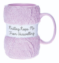 Load image into Gallery viewer,  A funny knitting themed mug, great for a knitting fanatic. Unwind with a cup of tea with this hilarious ceramic knitting mug, complete with a decorative gift box. Shaped like a pink ball of wool with the text &quot;Knitting keeps me from unravelling&quot;, this mug is a knitting lovers dream come true. A perfect gift for that knit lover on the birthday, at Christmas or an all year round gift.      Colour: Pink     Material: Ceramic     Dimensions Depth : 9.70 cm X Height : 12.50 cm X Width : 8.20 cm
