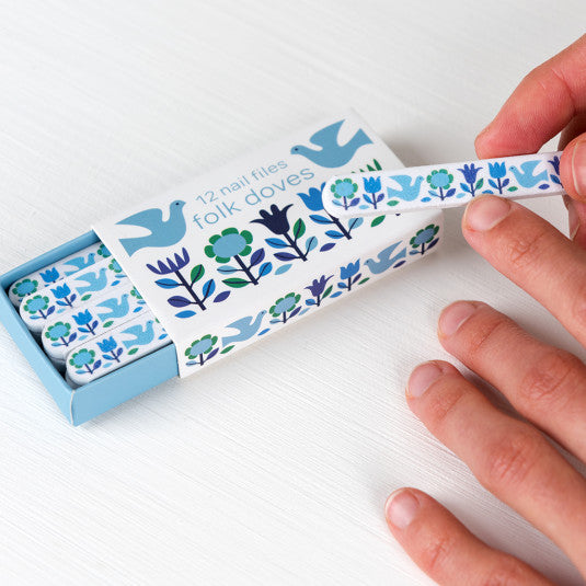 'Pocket-sized pack of mini nails files, featuring pretty Folk Blue Doves design, this fashion and portable accessory contains 12 hand file, useful to bring with you everywhere you go. Do not give up the care of your nails, do your manicure, even when you're in a hurry. Combine it with other products such as the portable brush with the same design!'      Material: card, foam, emery      Nail file measures: 7cm (length) x height 0.2 cm 1cm (width)