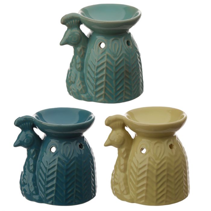 'Ceramic Peacock Oil Burner' -  to be used with a essential oils. This is a low-tech and inexpensive way to add beautiful aromas to your home.  Material: Ceramic Suitable for Use With: Water and oils. Candle Included: No Oils Included: No Dimensions: Height 10.5cm Width 10cm Depth 7.5cm Safety Information: Always read and follow the instructions that come with this product. Use a good quality standard tea light and do not overfill the dish. Product to be used with care and caution.