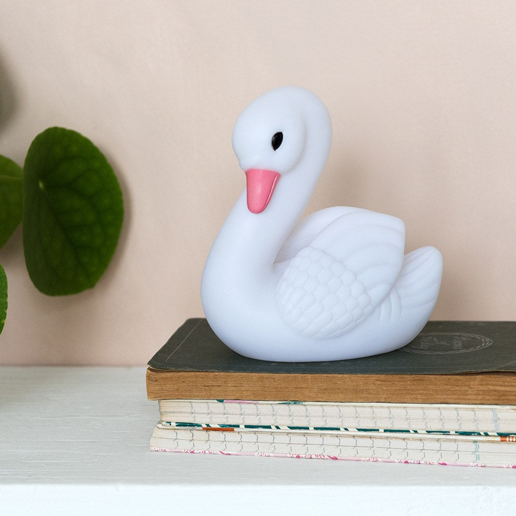 Relax in company of this adorable Little Swan night light, a perfect accessory for peaceful sleep in a sweet dream night. Put it on the bedside table or in a place where you need a soft light. Beloved article both children and adults as this swan has a nice and elegant style at the same time.      Requires 3 x LR44 batteries (included)     WARNING! Choking hazard; not for children under 3 years old     Material: Plastic     Dimensions: Length 11 cm Height 12.5 cm Width 7.5 cm