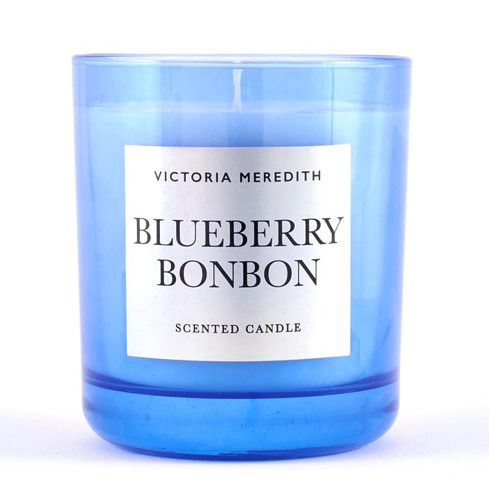This elegant Blueberry Bonbon candle is an elegant scented candle in a blue clear jar: it is the perfect way to release some deliciously sweet fragrance and help someone put their feet up and relax. The super pretty candle comes in a jar which can be used as a glass (when the candle wax is totally burnt - remember to clean it and to remove the wick) - jar with a metallic finish, so really does look as good as it smells. The fragrance is rich with sweet and succulent merry notes, perfect for anyone who is a 