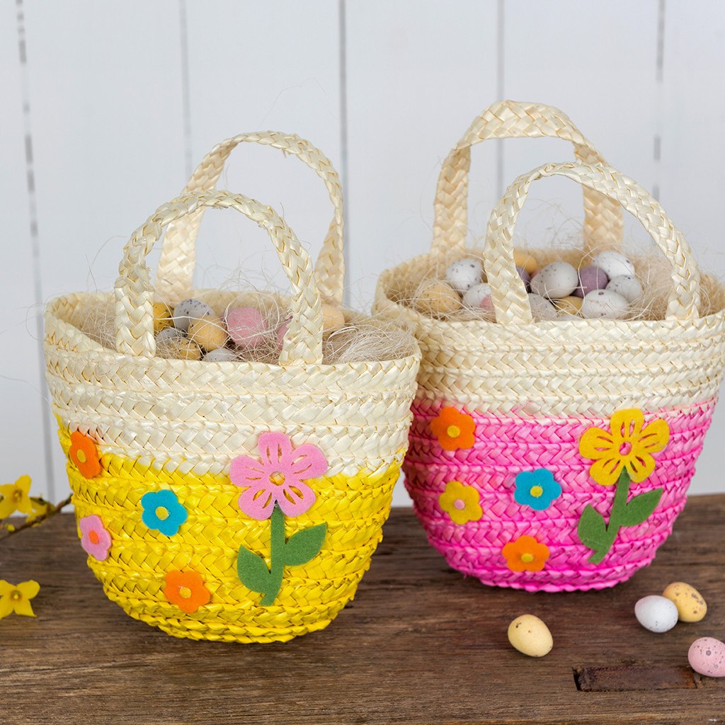 Lovely Mini Woven Flower Basket - This Easter, send the little ones off on their Easter egg hunt with a sweet woven straw basket! Available in two tones (yellow and pink), the bags are stuffed with hay-paper and colourful Easter eggs! Used as a Decorative item too.  Let's the Easter Egg Hunt begin :)      Material:  Felt, Straw     Dimensions: Length 20 cm Width 16 cm